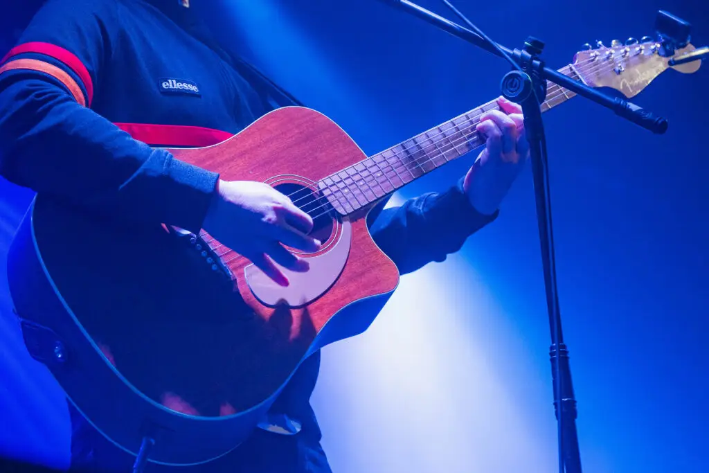 Close-up shot of Ryan Kershaw playing the guitar